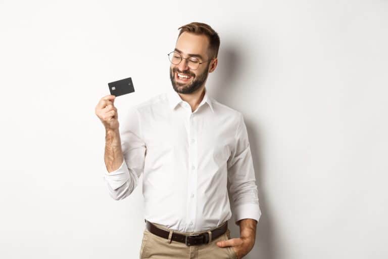 A happy man with his American Express Aeroplan Reserve card.