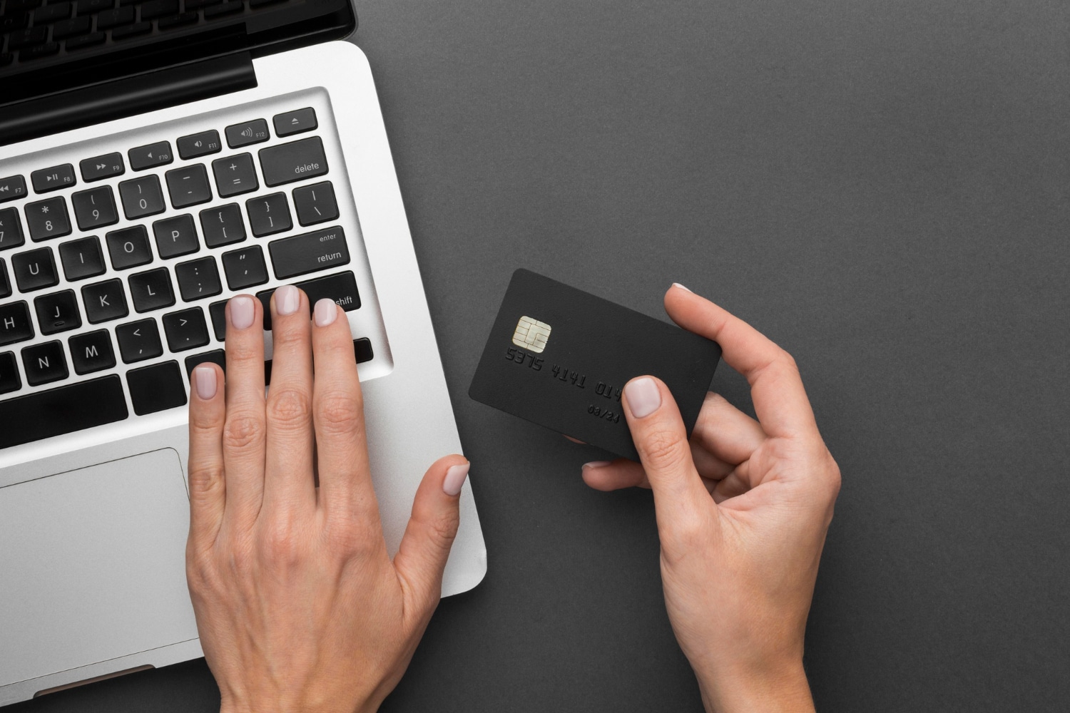 Someone using the CIBC Costco Mastercard with a computer.