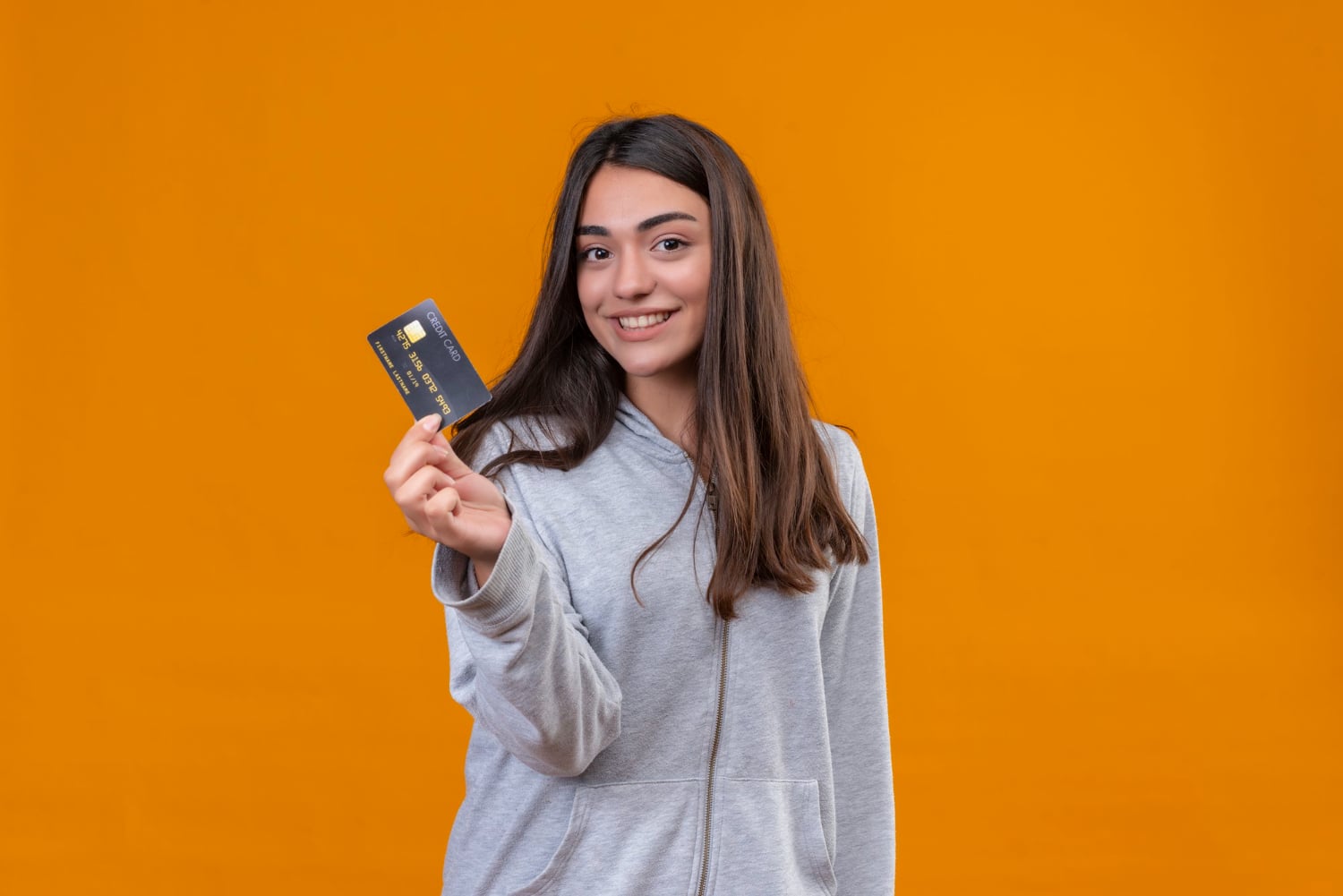 A girl holding her Marriott Bonvoy Business.