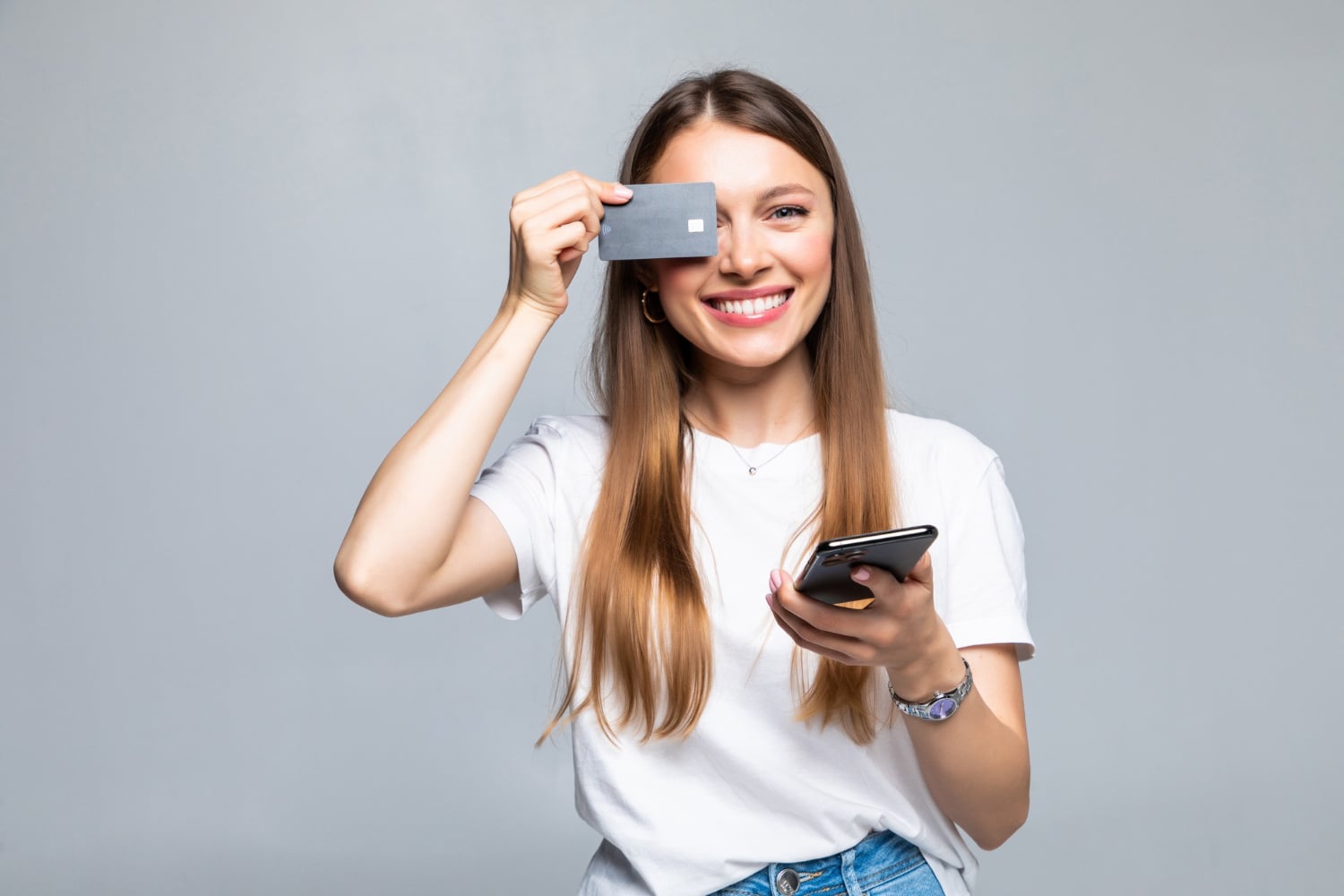 A girl using her Tangerine World Mastercard.