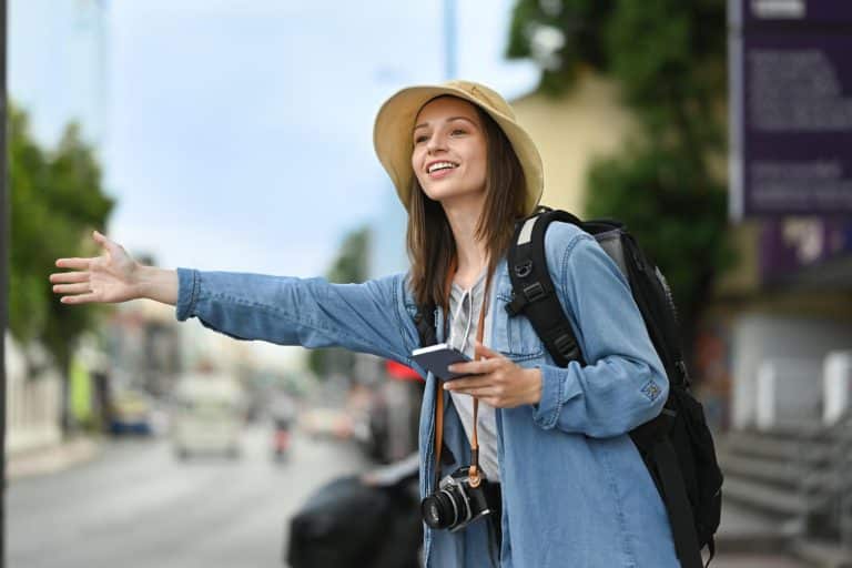 Woman using credit cards for travel during her trip.