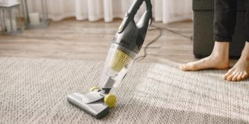 Someone using a Pet Hair Vacuum.