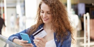 A girl using credit cards with cash back.