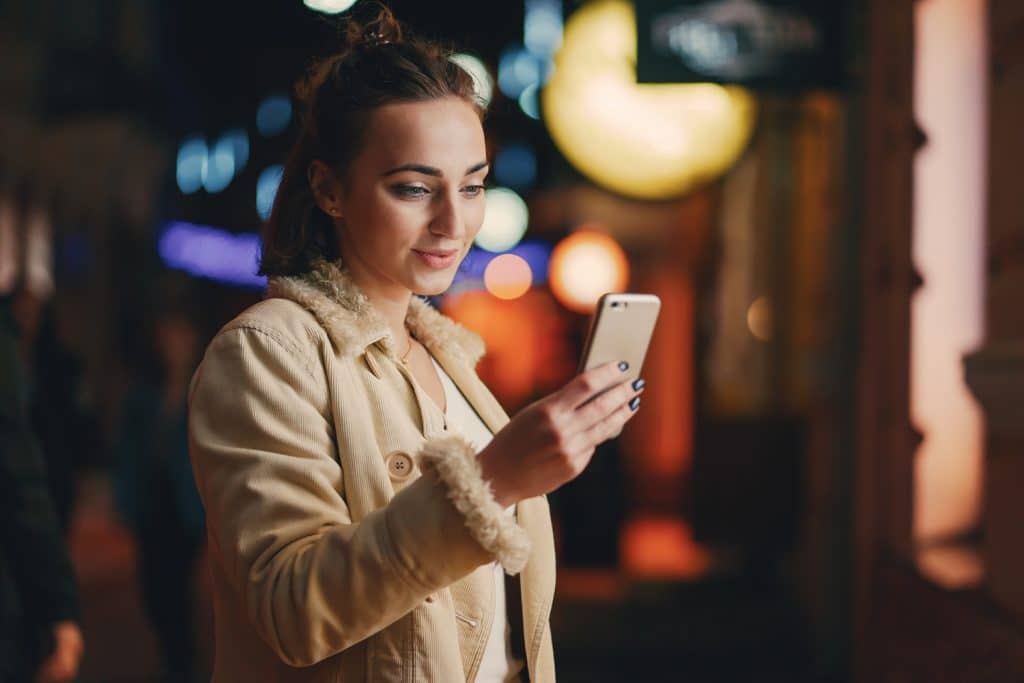 woman checking the Best Smartphones in 2024.