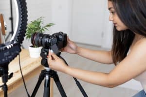 Woman using her Photography Equipment.