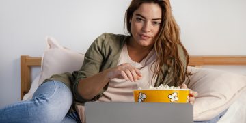 Canadian streaming services comparison: Find your best option woman-eating-popcorn-while-watching-movie-laptop