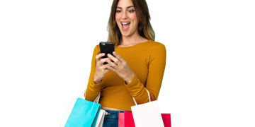 caucasian-woman-isolated-blue-background-holding-shopping-bags-writing-message-with-her-cell-phone-friend