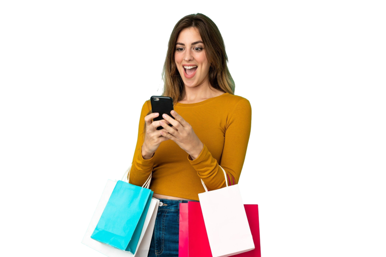 caucasian woman isolated blue background holding shopping bags writing message with her cell phone friend