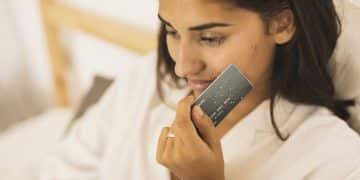 woman-holding-credit-card-her-cheek